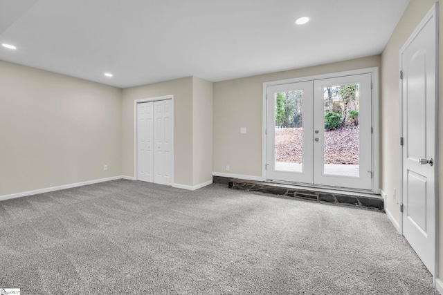 interior space with carpet floors, access to outside, baseboards, and recessed lighting