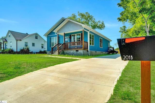 view of front of property featuring a porch, crawl space, a front lawn, and concrete driveway