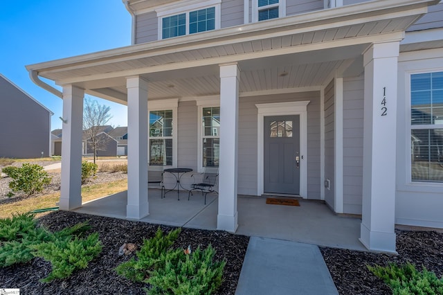 property entrance with covered porch