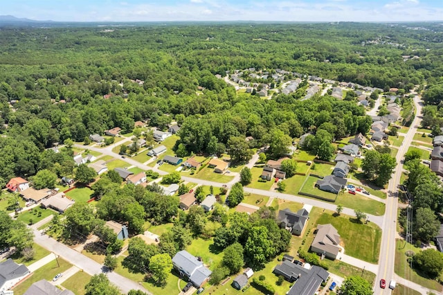 birds eye view of property with a wooded view and a residential view