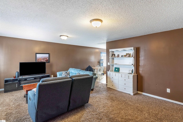 living room featuring carpet floors, a textured ceiling, and baseboards