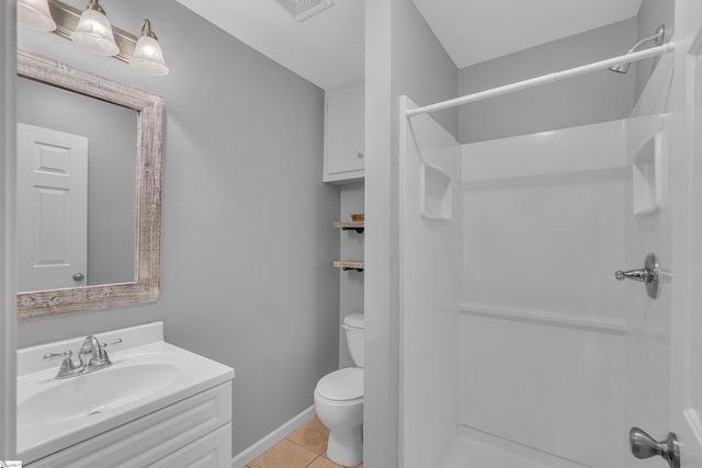 full bathroom featuring tile patterned flooring, toilet, visible vents, baseboards, and a shower stall