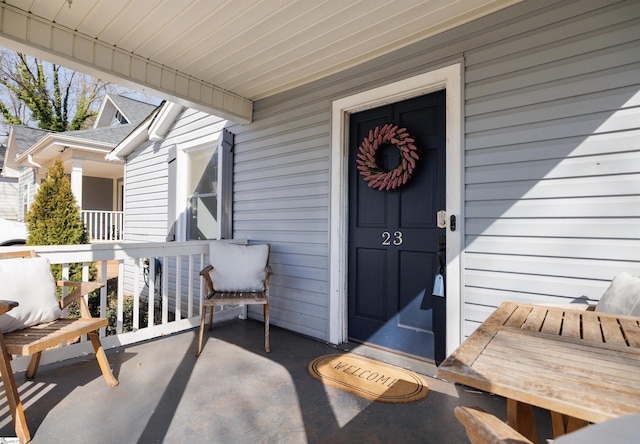 property entrance with covered porch