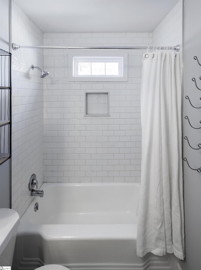 full bathroom with toilet and shower / bathtub combination with curtain