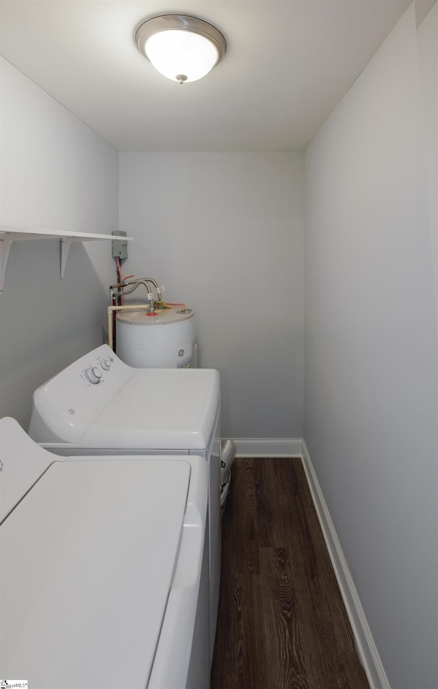 laundry area with laundry area, separate washer and dryer, dark wood-type flooring, baseboards, and water heater