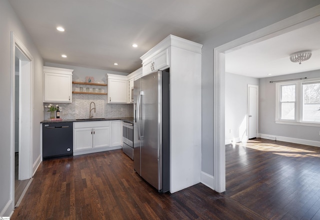 kitchen featuring a sink, white cabinets, appliances with stainless steel finishes, open shelves, and dark countertops