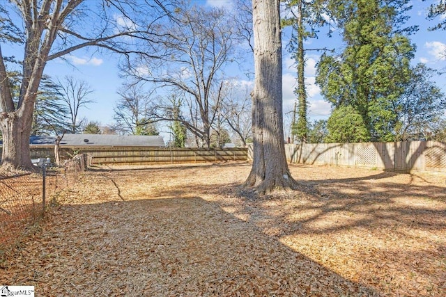 view of yard with a fenced backyard