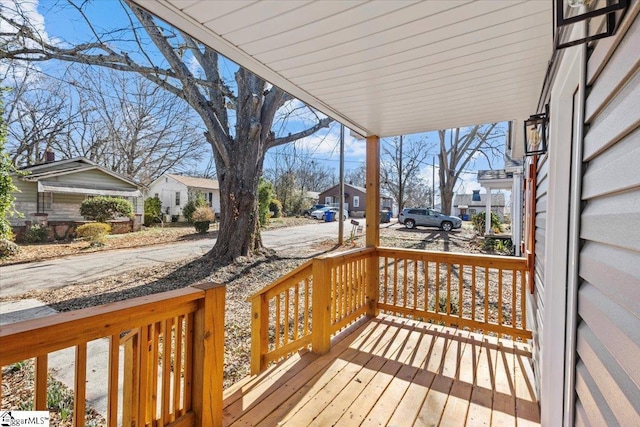 wooden deck with a residential view