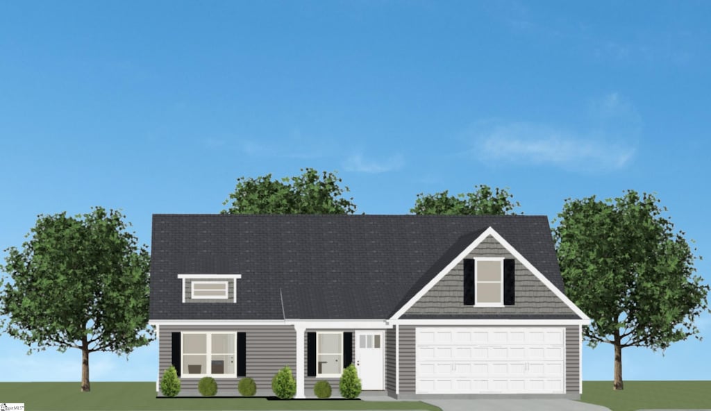 view of front of home featuring a front yard, concrete driveway, and an attached garage