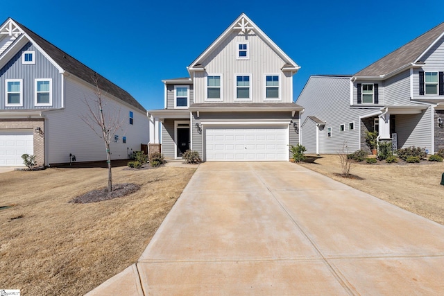 craftsman-style house with a garage, driveway, and board and batten siding