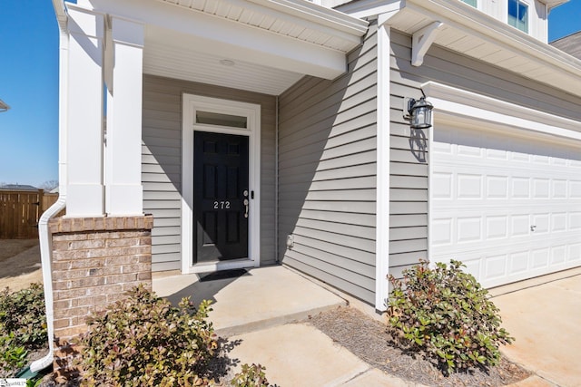 doorway to property featuring an attached garage