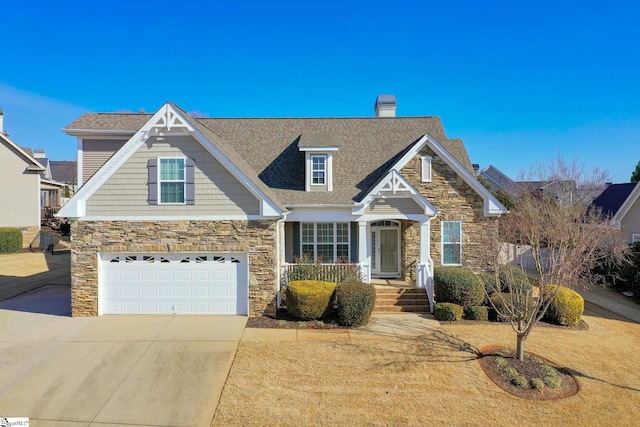 craftsman inspired home featuring an attached garage, stone siding, concrete driveway, roof with shingles, and a chimney