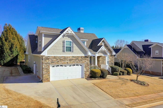 craftsman inspired home featuring a chimney, a shingled roof, a garage, stone siding, and driveway