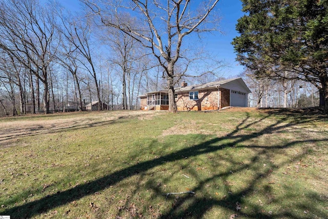 view of yard featuring a garage