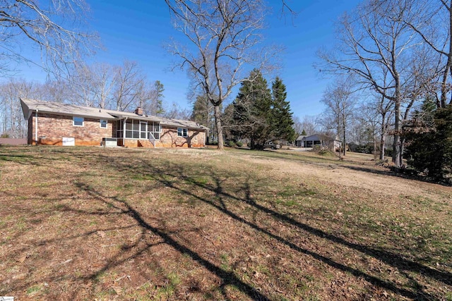 view of yard with a sunroom