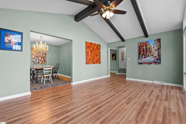 unfurnished living room with vaulted ceiling with beams, light wood-style flooring, visible vents, and baseboards