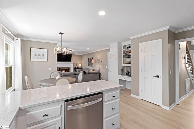 kitchen featuring light wood-style floors, white cabinetry, dishwasher, and a lit fireplace