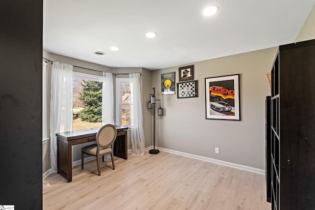 office space featuring baseboards, recessed lighting, visible vents, and light wood-style floors