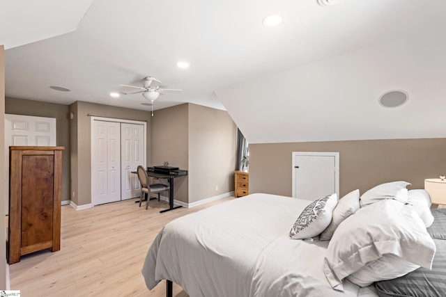 bedroom with lofted ceiling, ceiling fan, light wood-style flooring, and baseboards