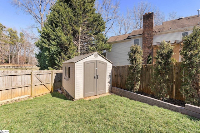 view of shed with a fenced backyard