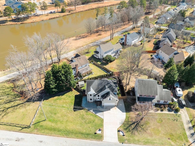 bird's eye view featuring a residential view and a water view