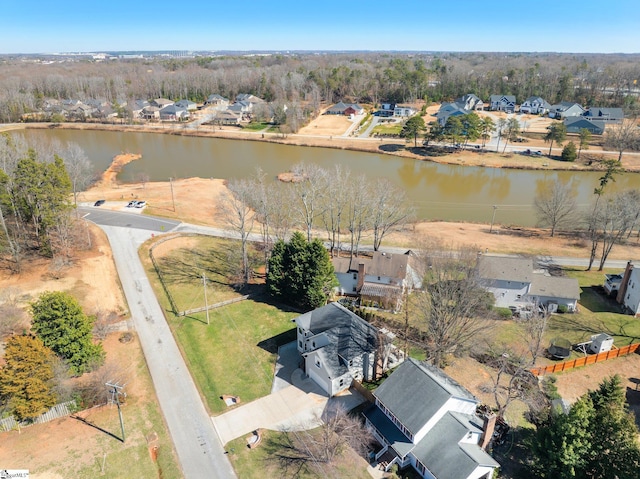 drone / aerial view with a water view and a residential view