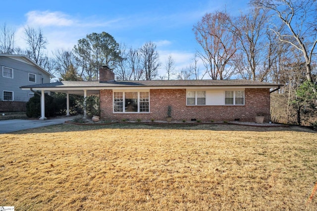 ranch-style home with brick siding, a chimney, and a front lawn