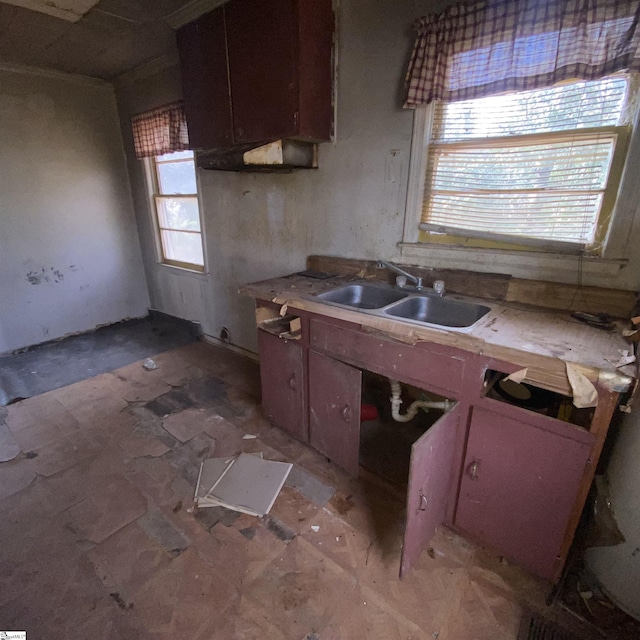 kitchen featuring light countertops and a sink