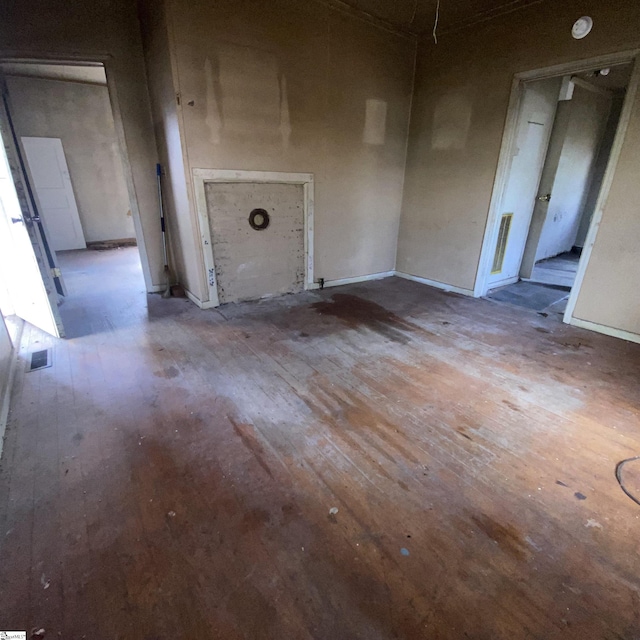 interior space with wood-type flooring and visible vents