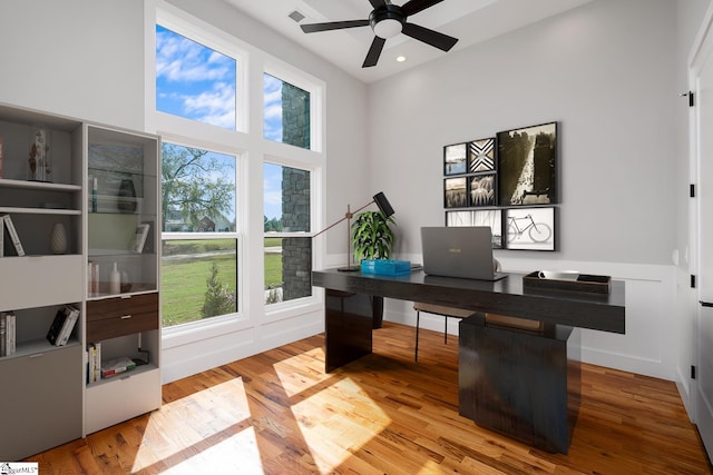 office area with a healthy amount of sunlight, ceiling fan, wood finished floors, and recessed lighting