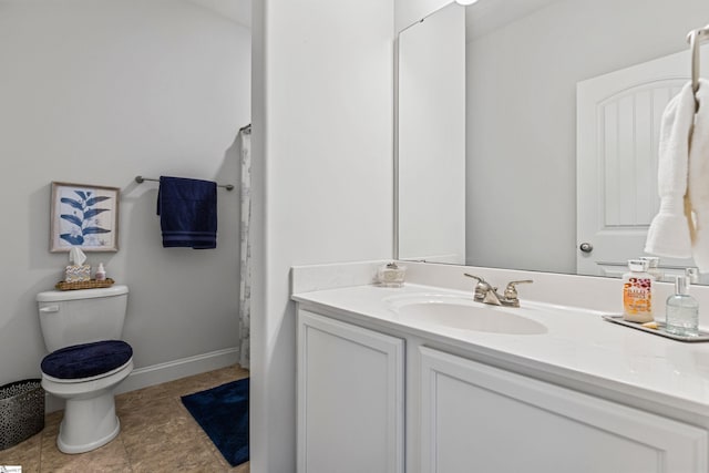 full bathroom featuring baseboards, vanity, toilet, and tile patterned floors