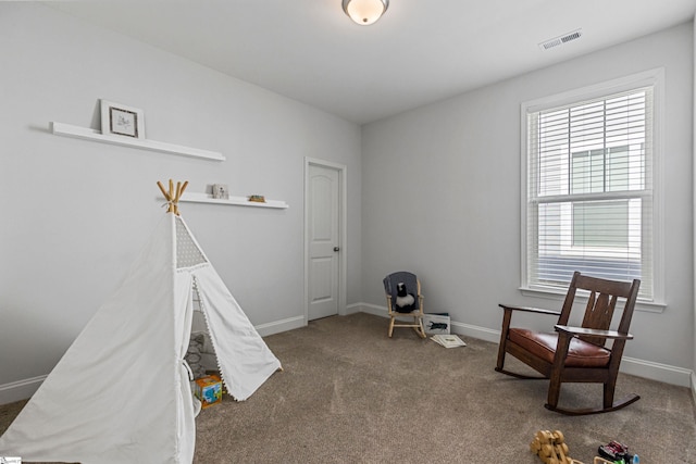 playroom featuring carpet floors, visible vents, and baseboards