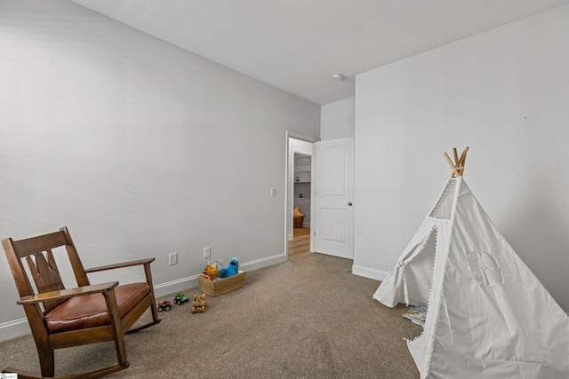 game room featuring carpet and baseboards