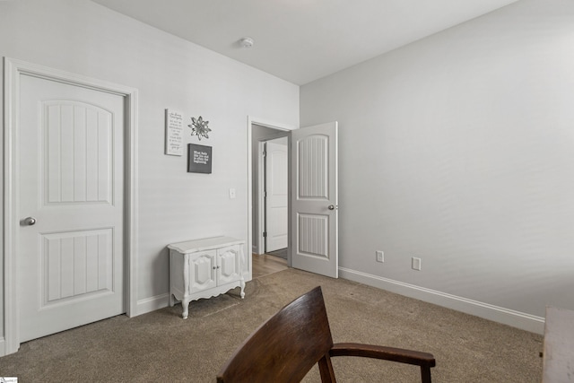 bedroom with carpet flooring and baseboards