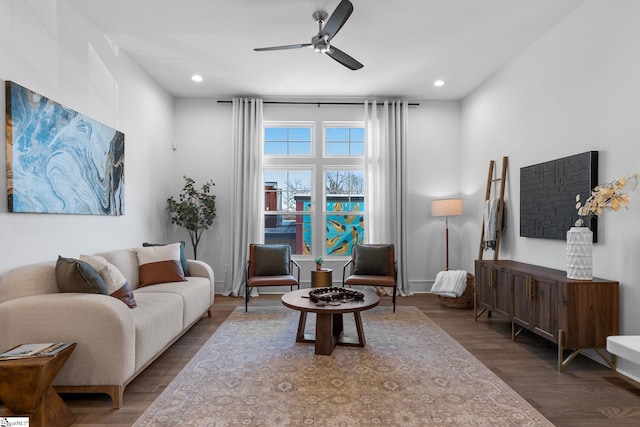 living room with ceiling fan, wood finished floors, and recessed lighting