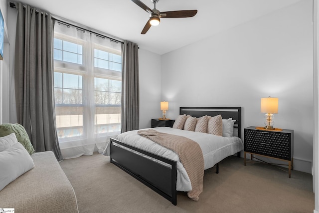 carpeted bedroom with a ceiling fan