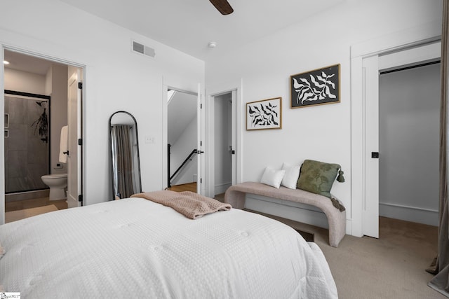 bedroom with visible vents, ensuite bath, ceiling fan, carpet flooring, and a closet