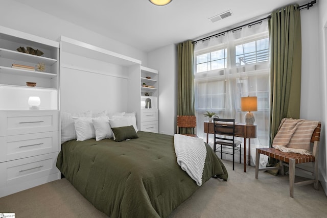 bedroom with light carpet and visible vents