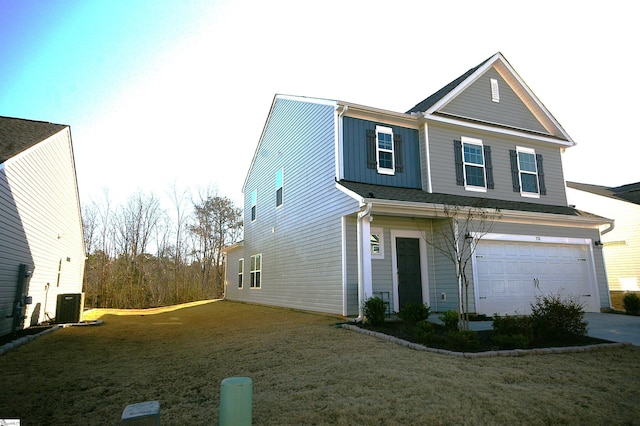 view of front of house featuring a front lawn and an attached garage