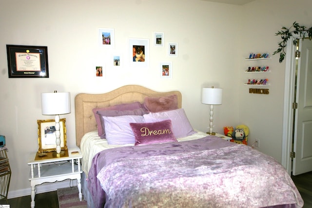 bedroom featuring wood finished floors