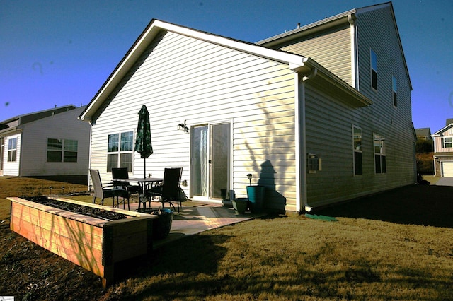 rear view of property with a patio area