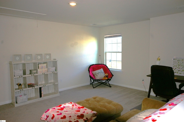 bedroom with attic access, carpet flooring, and baseboards