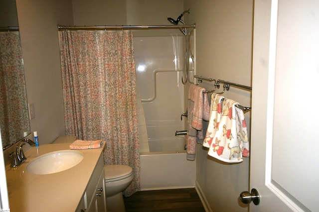 full bathroom featuring shower / bath combination with curtain, vanity, toilet, and wood finished floors