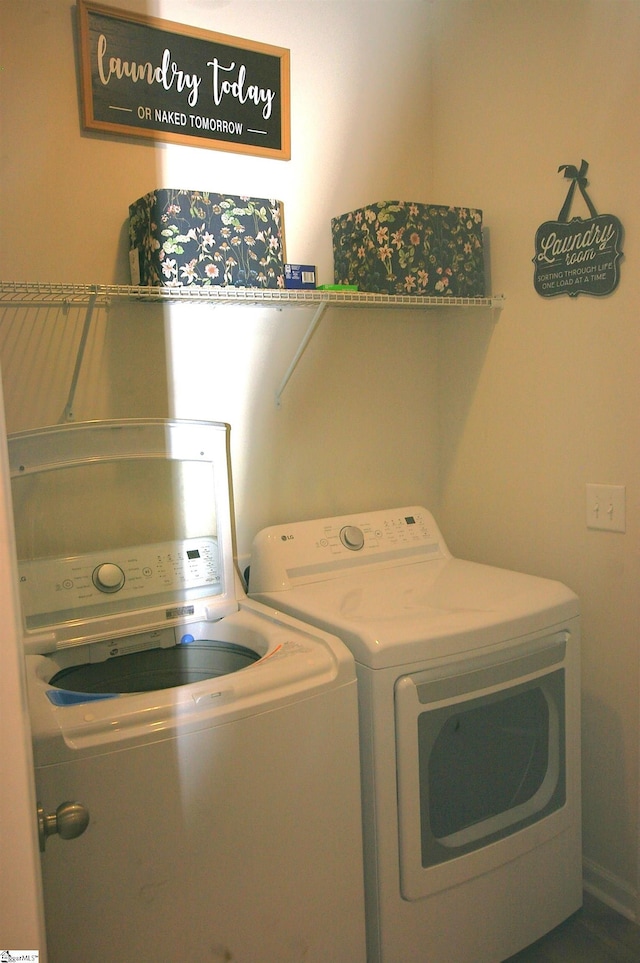 laundry area with laundry area and separate washer and dryer