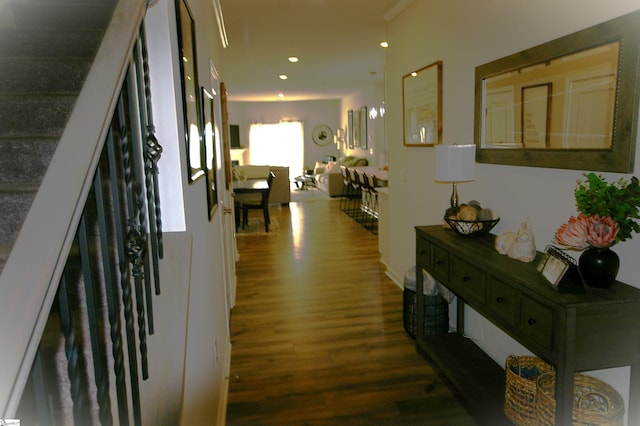 corridor with recessed lighting, stairway, and wood finished floors