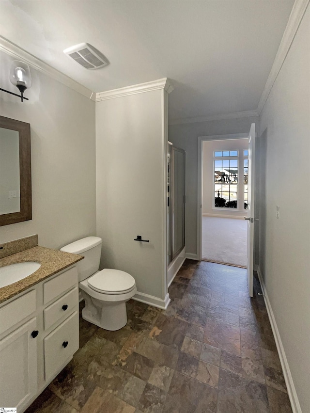 bathroom with vanity, visible vents, baseboards, a stall shower, and crown molding