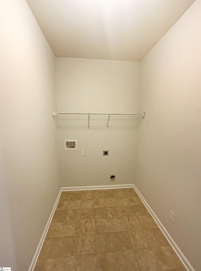 laundry room featuring laundry area, hookup for a washing machine, baseboards, and hookup for an electric dryer