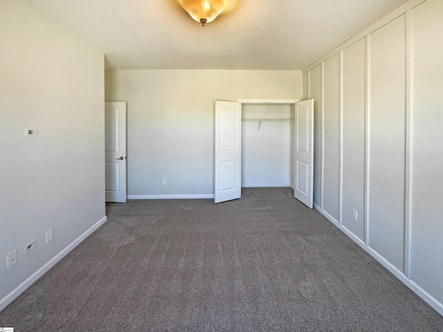 unfurnished bedroom with carpet and baseboards