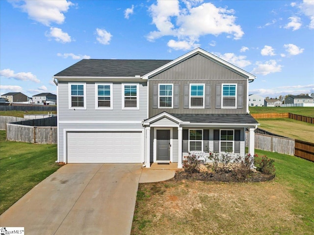 traditional-style house with concrete driveway, an attached garage, board and batten siding, fence, and a front lawn