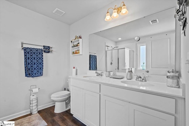 full bath with a stall shower, visible vents, a sink, and toilet